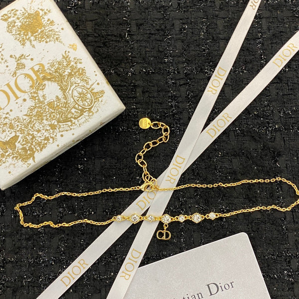 CD 26S CD Logo CZ Station Necklace In Gold Tone Metal 631851