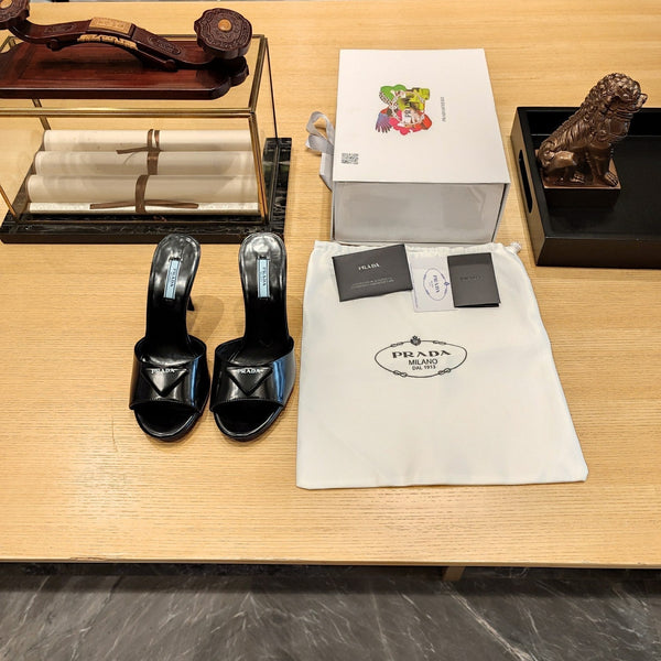 Prada 26S Open-Toe Mules 100mm in Black Patent Calfskin with Logo