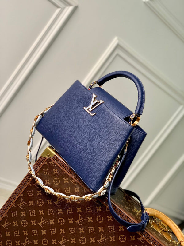 capucines mm 31.5 dark blue taurillon leather gold hardware