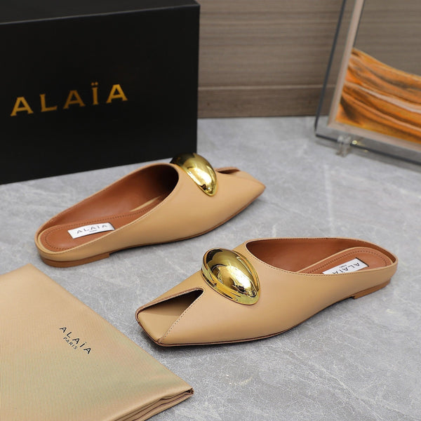 ALAIA FLAT MULE IN SEPIA TAN LAMBSKIN WITH GOLD HARDWARE