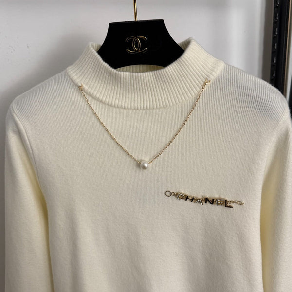 Chanel Metal Logo Lettering Pearl Gold Necklace Tassel Long-Sleeve Knit Top