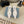 TRIANGLE LOGO SLINGBACK PUMPS IN WHITE GLOSSY CALFSKIN