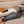 LV TRAINER IN BLACK MIX DARK BROWN CALFSKIN