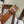 BUCKET 30 IN WHITE TRIOMPHE CANVAS AND RED BROWN CALFSKIN TRIM