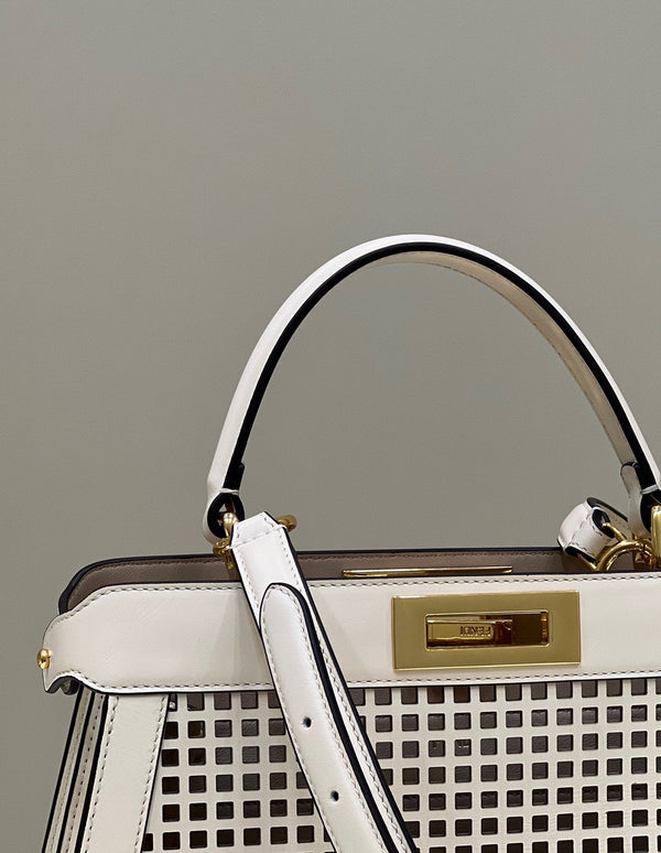 PEEKABOO ISEEU 34 IN WHITE PERFORATED CALFSKIN GOLD HARDWARE