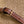 SMALL BUCKET CUIR TRIOMPHE 22CM IN STRIPED TEXTILE AND TAN CALFSKIN