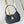 LOW KEY SHOULDER BAG 26 IN BLACK GRAINED CALFSKIN GOLD BUCKLE