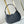 LOW KEY SHOULDER BAG 26 IN BLACK GRAINED CALFSKIN GOLD BUCKLE