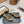 ALAIA THREE-STRAPS HIGH HEEL SANDALS IN GOLDEN PATENT LAMBSKIN