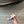 ALAIA FOLDED FLAT MULES WITH SPHERES ON WHITE CALFSKIN