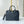 SPEEDY BANDOULIÈRE 25 WITH CRISS CROSS PATTERN IN BLACK LAMBSKIN