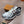 New Balance 1906R Low in the Silver Classic Crimson Mesh Calfskin