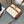 TEEN TRIOMPHE 18.5 WHITE MONOGRAM CANVAS TAN CALFSKIN