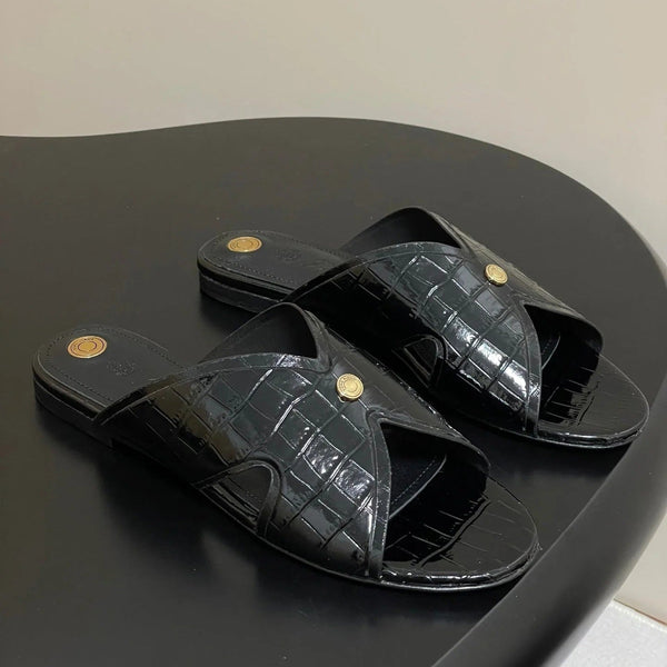 FLAT SLIPPERS IN BLACK CALFSKIN SNAKE EMBOSSING