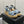 PEEP-TOE THICK SOLE SANDALS IN STONE BLUE PATENT LAMBSKIN
