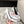 POINTED HIGH PUMPS IN WHITE PATENT CALFSKIN WITH CRYSTAL BUCKLE