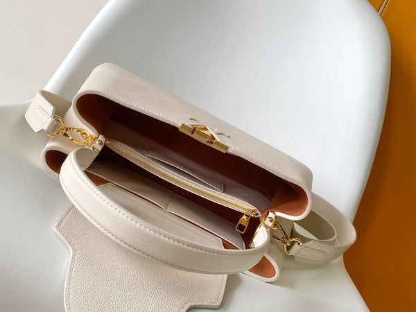 CAPUCINES GM 33CM BEIGE GOLD TAURILLON LEATHER 252023