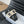 WOVEN SLIDE IN RAFFIA AND BLACK LAMBSKIN