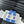 WOVEN SLIDE IN RAFFIA AND CERULEAN BLUE LAMBSKIN