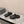 CUT-OUT MULES IN BLACK RUBBER