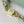 capucines mm 31.5 green beige taurillon leather gold hardware