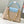 capucines bb 27 beige cloud blue taurillon leather gold hardware