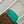 CAPUCINES MINI 21 GREEN CROCODILE EMBOSSED CALFSKIN GOLD HARDWARE