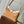 CARRYALL PM 29 IN CIDER BROWN MONOGRAM PERFORATED SUEDE AND WHITE SHEARLING TRIM