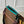 GASTON WEARABLE WALLET 18 IN BROWN MONOGRAM CANVAS MIX GREEN CALFSKIN