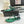 SL CRYSTAL T-STRAP FLAT SANDAL DARK GREEN SATIN