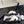 cross puffy slippers white black lycra fabric