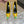 GREEN GEM-STUDDED HIGH PUMPS IN YELLOW PATENT CALFSKIN