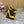 GREEN GEM-STUDDED HIGH PUMPS IN YELLOW PATENT CALFSKIN