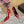 ORANGE GEM-STUDDED HIGH PUMPS IN RED PATENT CALFSKIN
