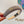 KHAKI BROWN FABRIC HAIRBAND WITH GOLD LOGO 414435