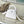 CAPUCINES EAST-WEST MINI 21 IN WHITE TAURILLON