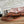 HERBAG ZIP 31 RETOURNE PEGASE POP BAG IN OFF-WHITE MIX RED CANVAS AND HUNTER COWHIDE