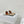 ALAIA FLAT MULE IN WHITE GLOSSY LAMBSKIN