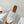 ALAIA VIENNE FLAT MULES IN WHITE LAMBSKIN
