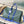 KEEPALL BANDOULIÈRE 45 IN BLUE GREEN DAMIER HERITAGE COATED CANVAS