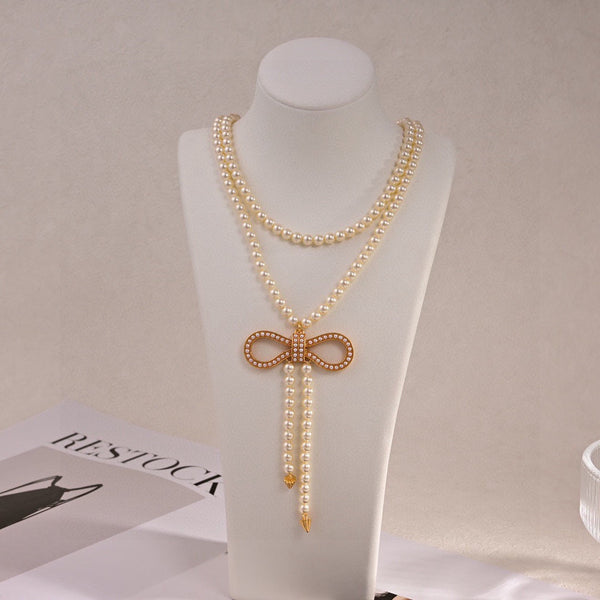 CD 26S Pearl Bow Drop Statement Necklace In Gold Tone Metal 629848