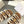 TIPPI SLIDE IN WHITE SHEARLING AND BROWN CALFSKIN