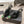 DUNE HIGH 10 CM SLINGBACK PUMPS IN BLACK PATENT LEATHER WITH GREEN CRYSTAL