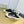 SNEAKER MULES IN BLACK CANVAS GRAFFITI LOGO