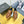 LOAFER WITH TRIANGLE LOGO IN COGNAC CALFSKIN