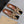 ALAIA FLAT MULE IN LEOPARD LAMBSKIN