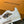 LV TRAINER SNEAKERS IN WHITE CALFSKIN AND CAMEL BROWN SUEDE