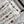 LV 25 Decorative Pattern Gemstone Chain Pleated Skirt White Poliester